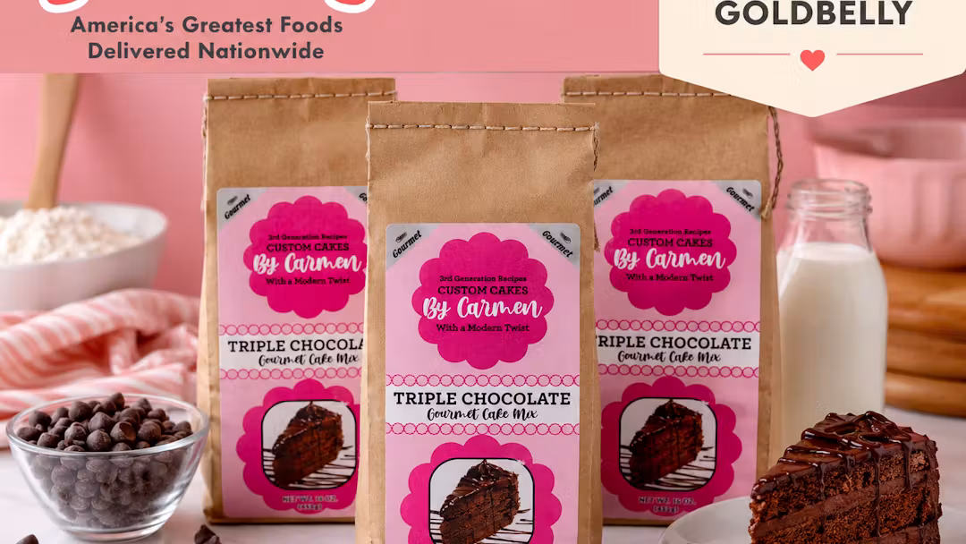 Custom Cakes By Carmen Triple Chocolate Gourmet Cake Mix pouches beside a slice of chocolate cake